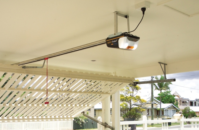 ATA garage door motor is mounted on a sectional door track in a residential garage.
