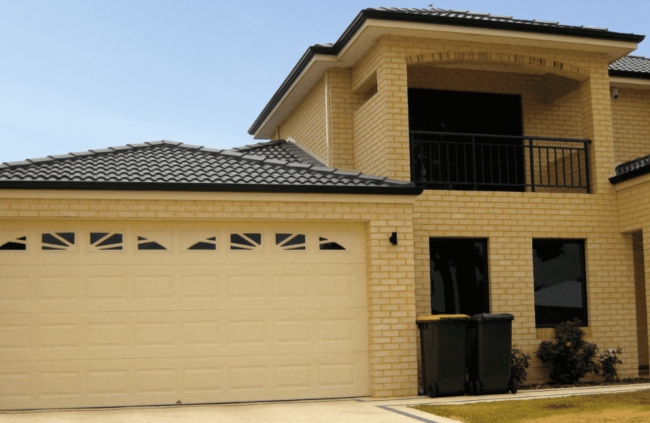Beige Centurion garage door installed on a residential property by Garage Door Guys Sydney