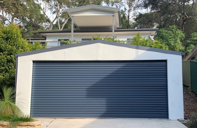 Gliderol roller door installed on a standalone garage at a residential home by Garage Door Guys Sydney