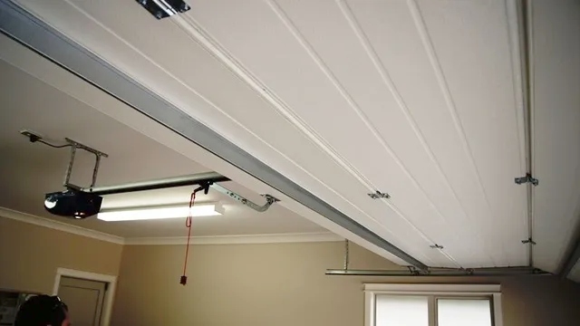 Superlift garage motor is fitted to a sectional garage door system in a residential garage by Garage Door Guys Sydney